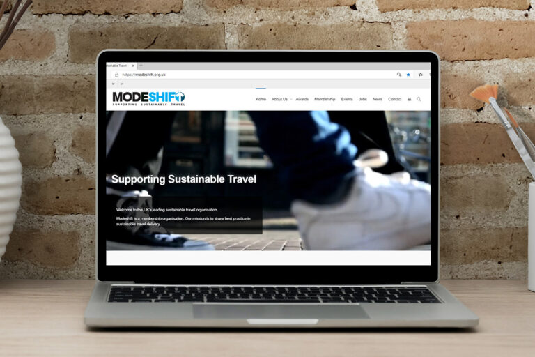 Modeshift home page on a mac laptop