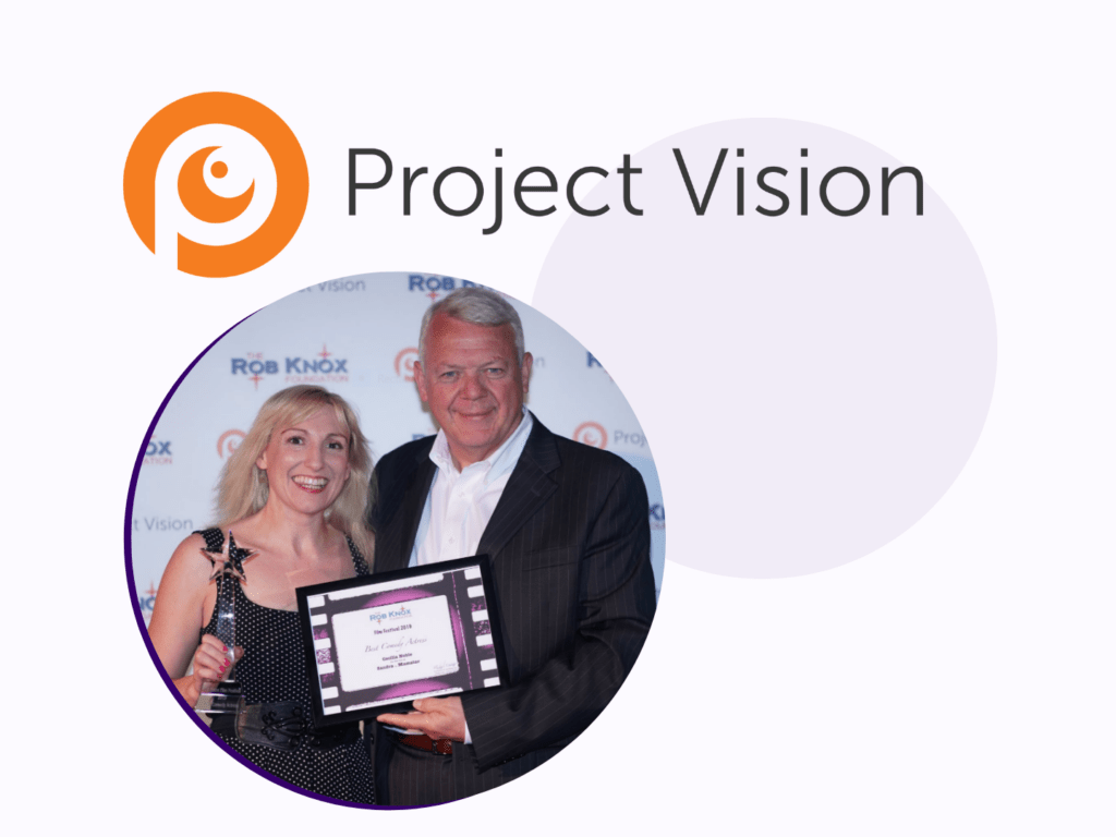 The project vision logo with an image below it of a man and a woman holding an award.