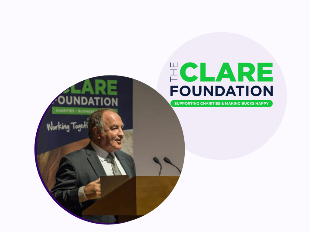 A graphic image with a circle on the left has an image of a white man talking on a podium with microphones. Above this is The Clare Foundation logo.